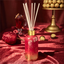 Apple Cider Social red and gold reed diffuser.