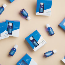 Blue bottles and boxes on a beige background