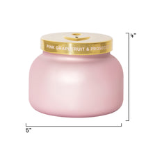 Pink candle with a gold lid labeled 'Pink Grapefruit & Prosecco' on a white background with dimensions indicated.