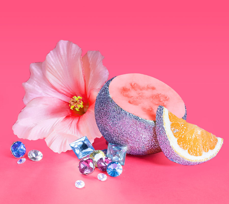 A sparkling guava fruit and blossom surrounded by jewels