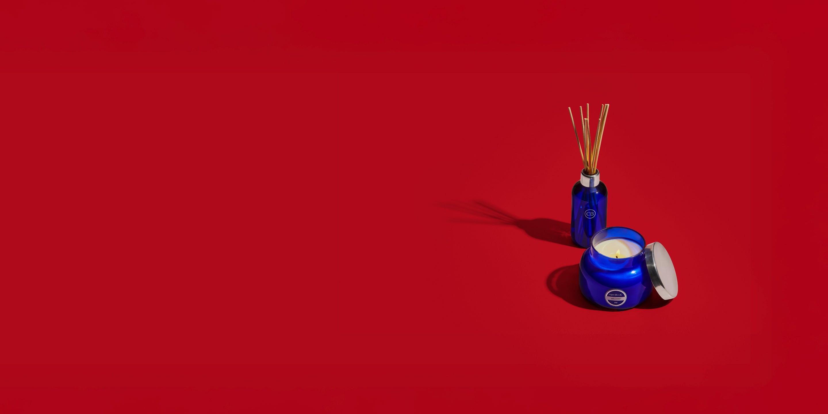 Blue diffuser and jar on a red background