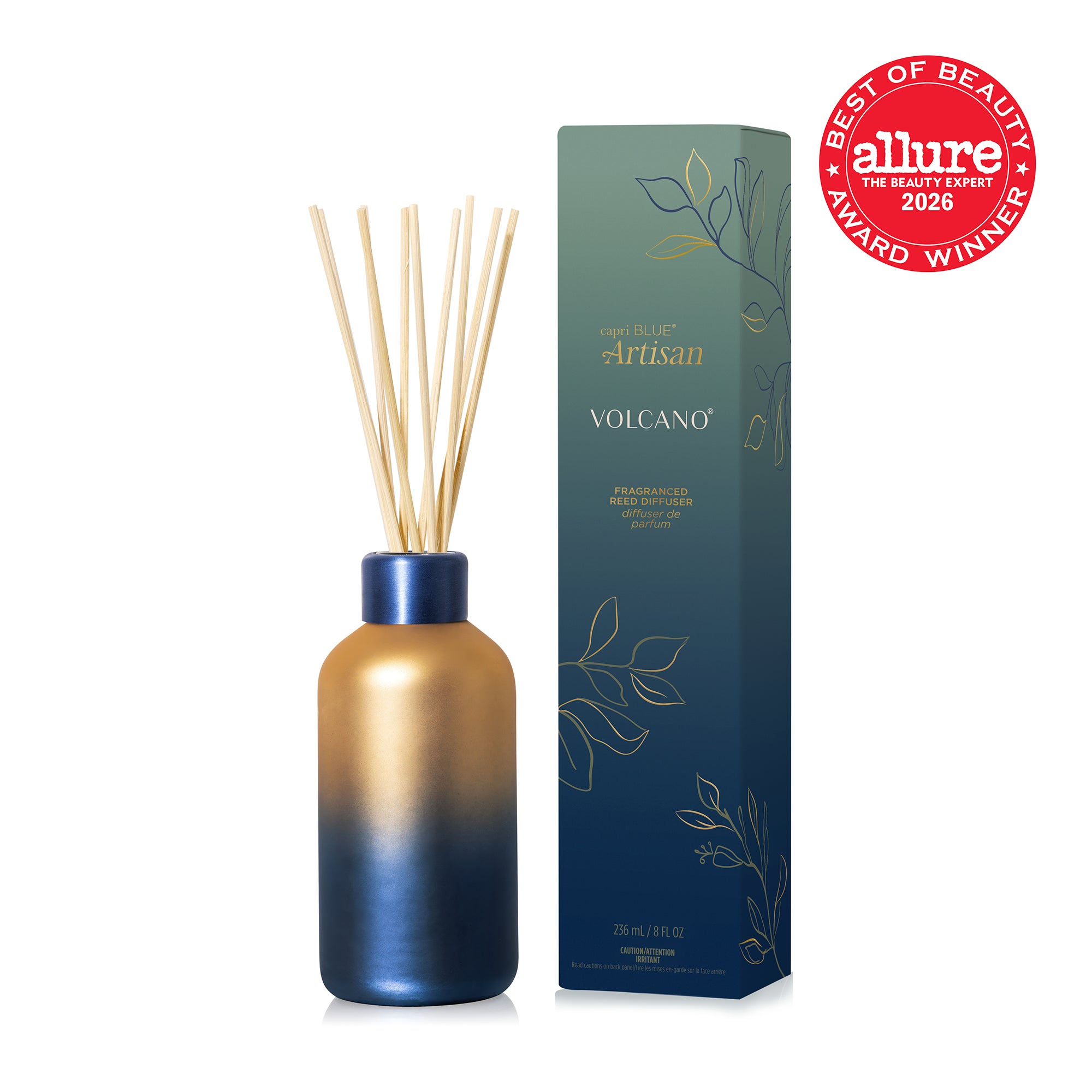 A blue ember and gold ombre, matte glass diffuser bottle with natural wood reeds and matching blue metallic collar, next to its blue and green packaging box and the Allure 2026 Best of Beauty Award Winner seal.