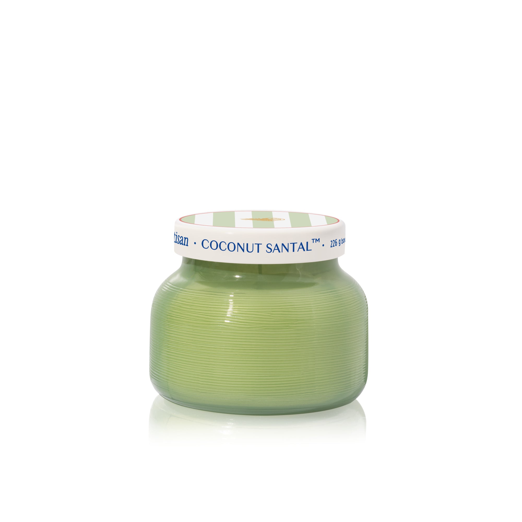 Green candle jar with a white lid on a white background
