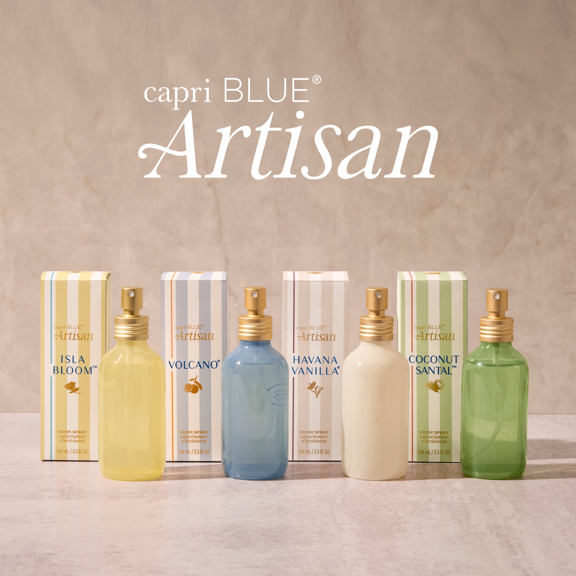 capri BLUE Artisan perfume bottles and boxes on a textured surface with 'capri BLUE Artisan' branding.