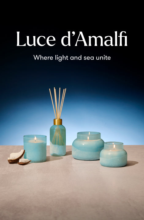 Luce d'Amalfi products including candles and diffusers on a blue background with text.