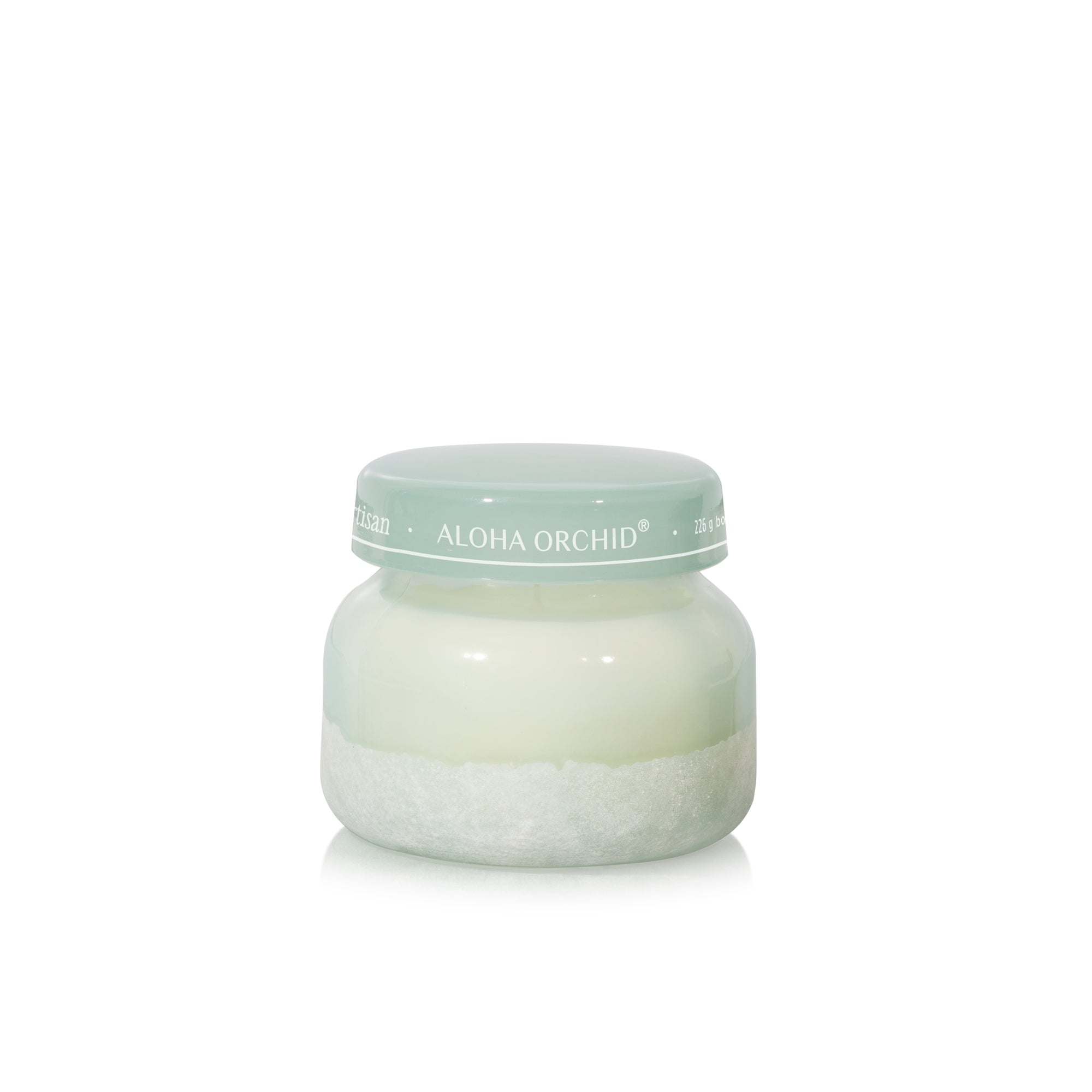 Jar of cream with a light green lid on a white background