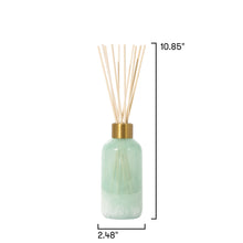 Green diffuser bottle with wooden sticks and measurements on a white background