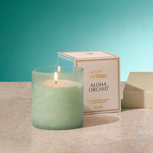 Aloe Orchid candle with packaging on a neutral background