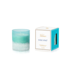 Candle with a gradient design and its packaging on a white background