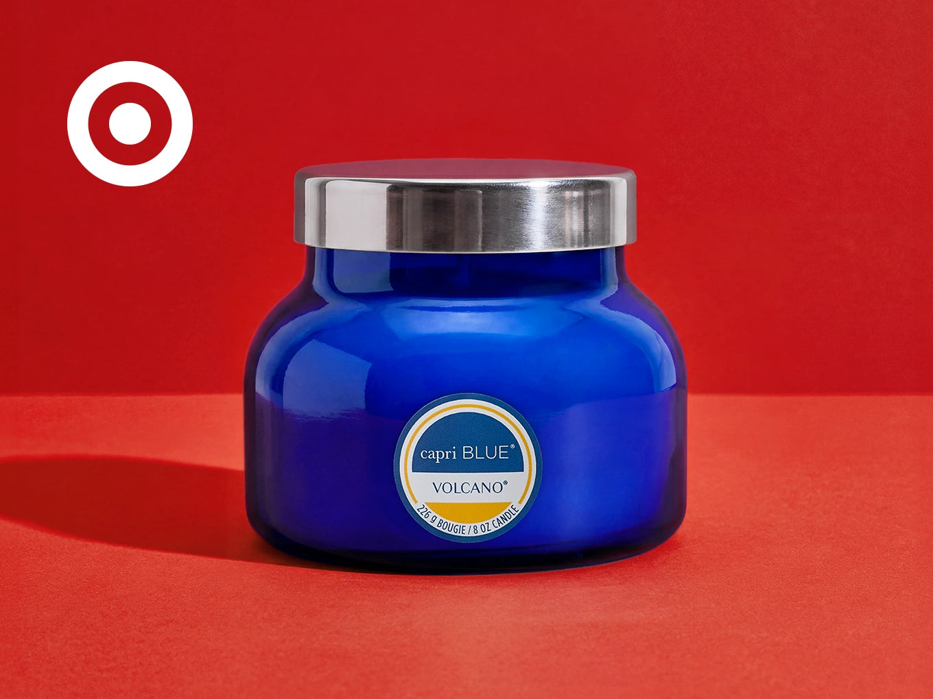 Volcano Signature Candle on a red background with a Target logo