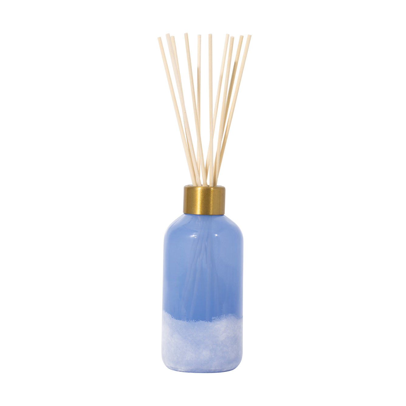 Blue diffuser bottle with gold cap and wooden sticks on a white background