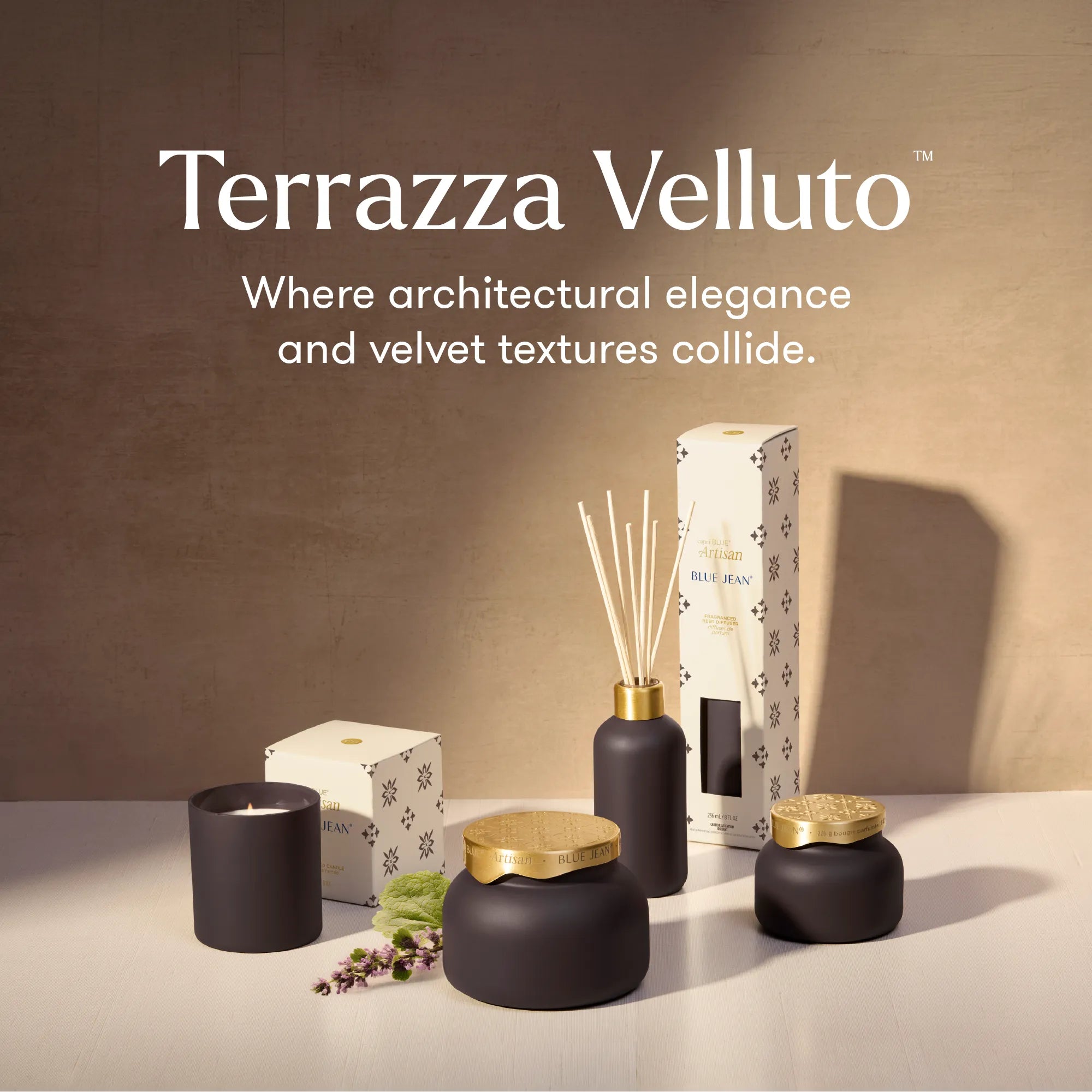 Terrazza Velluto home fragrance collection including a candle, reed diffuser, and jars with gold lids, displayed on a white surface against a textured beige wall with product text overlay.