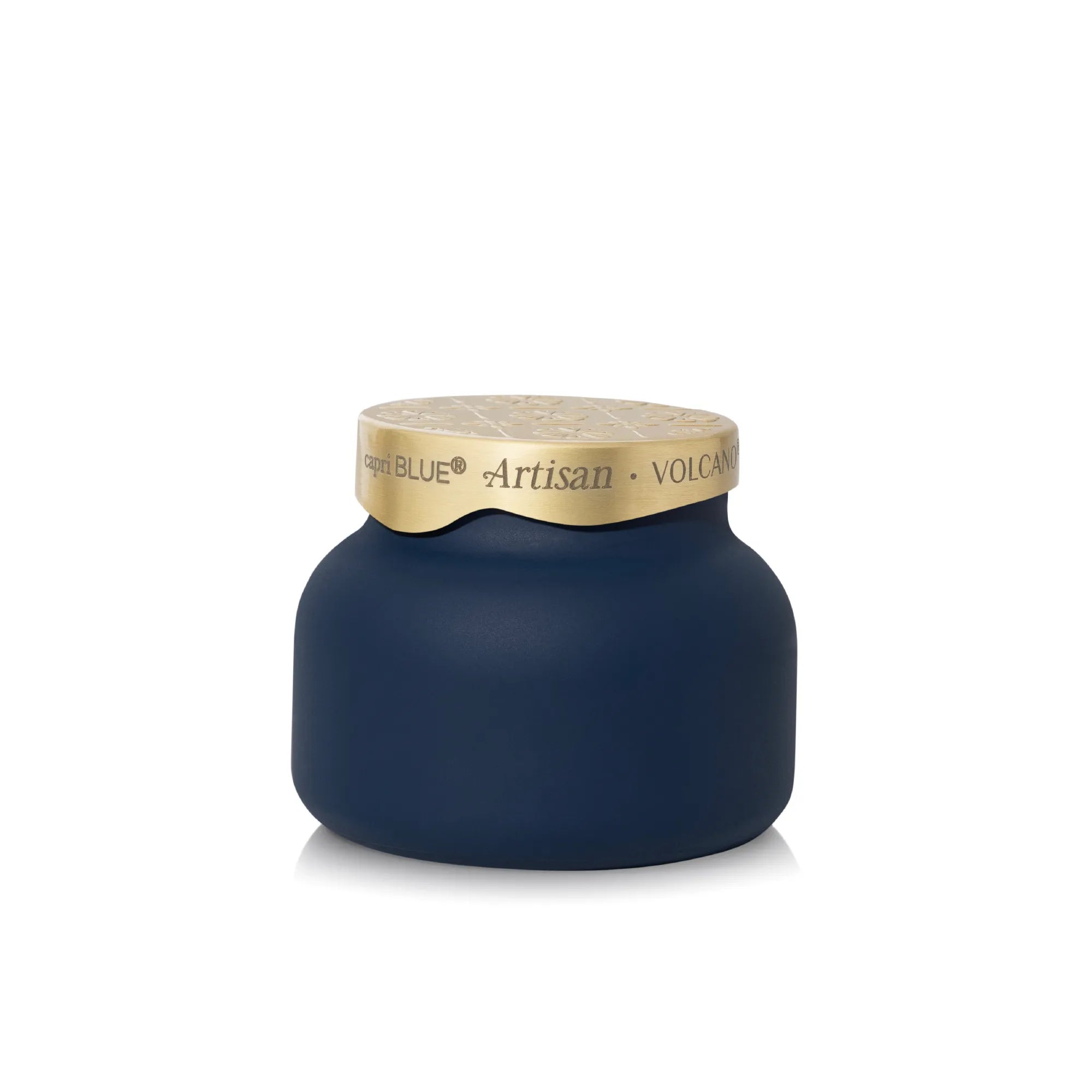 A New Blue Artisan Volcano candle in a rounded matte navy blue jar with a textured gold lid, shown on a clean white background.