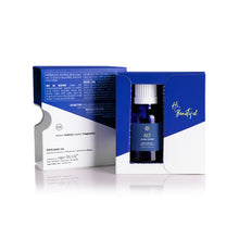 Blue diffuser oil bottle with packaging on a white background