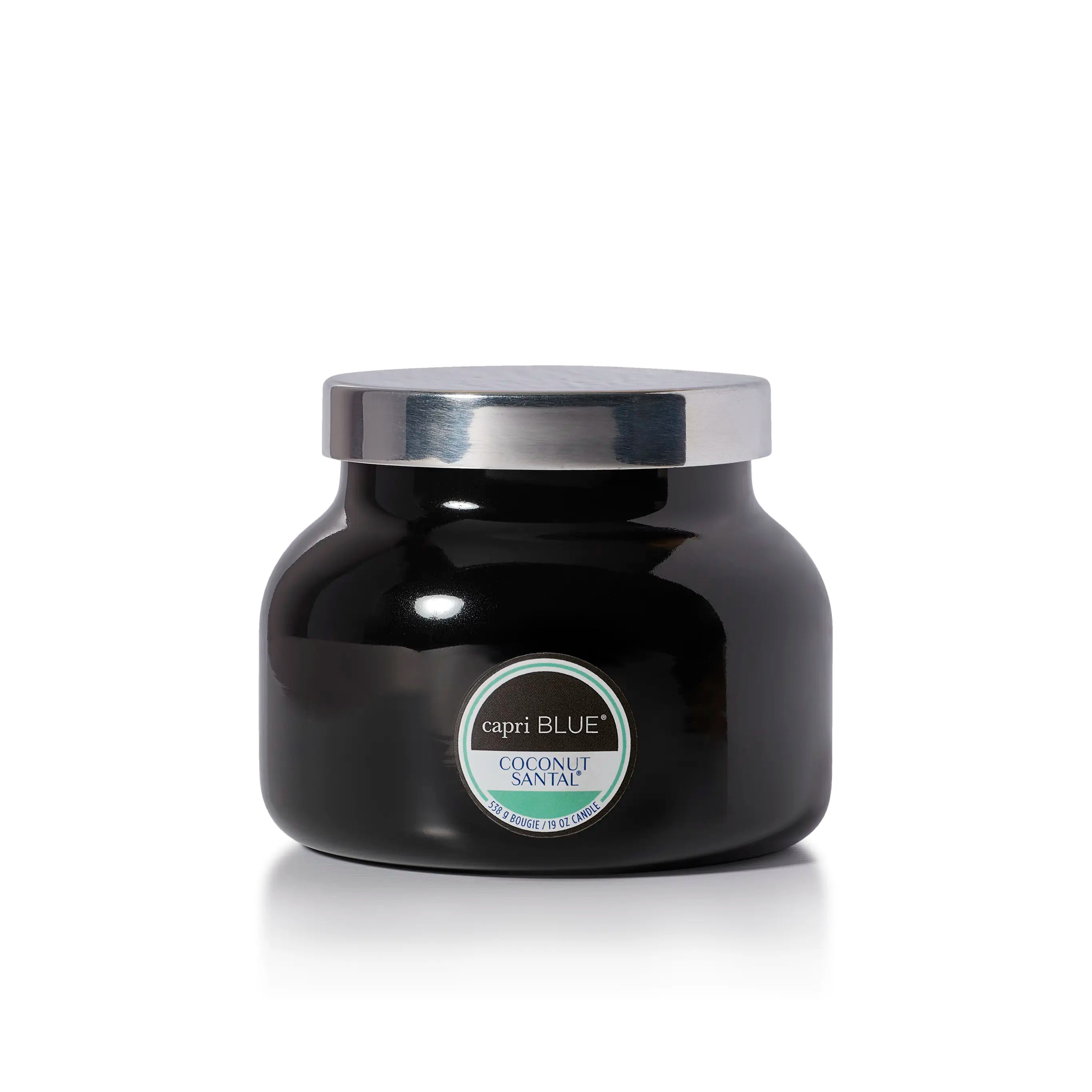 A black glass jar candle with a shiny silver lid and a circular label reading 'capri BLUE' and 'HAVANA VANILLA'.
