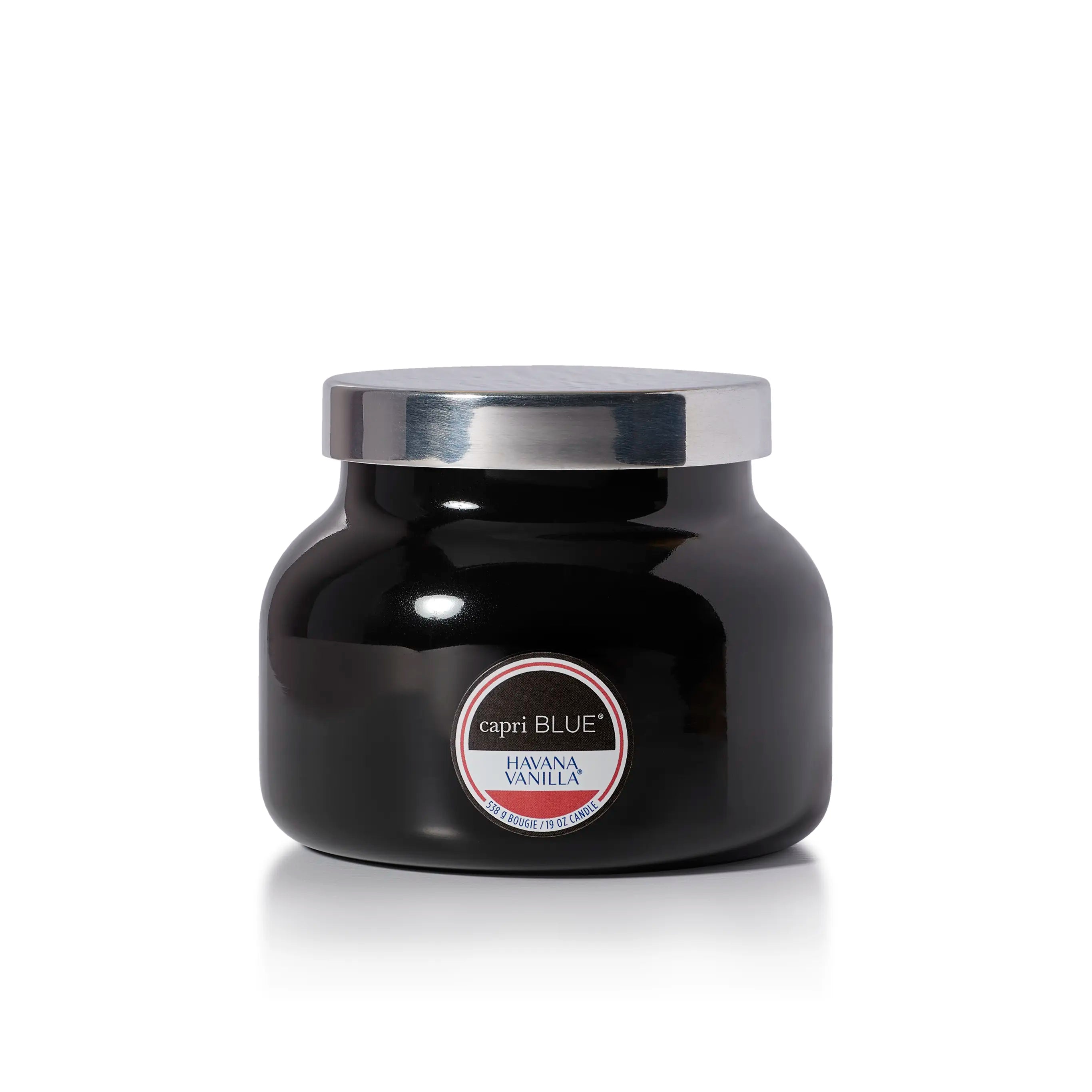 A black glass jar candle with a shiny silver lid and a circular label reading 'capri BLUE' and 'HAVANA VANILLA'.