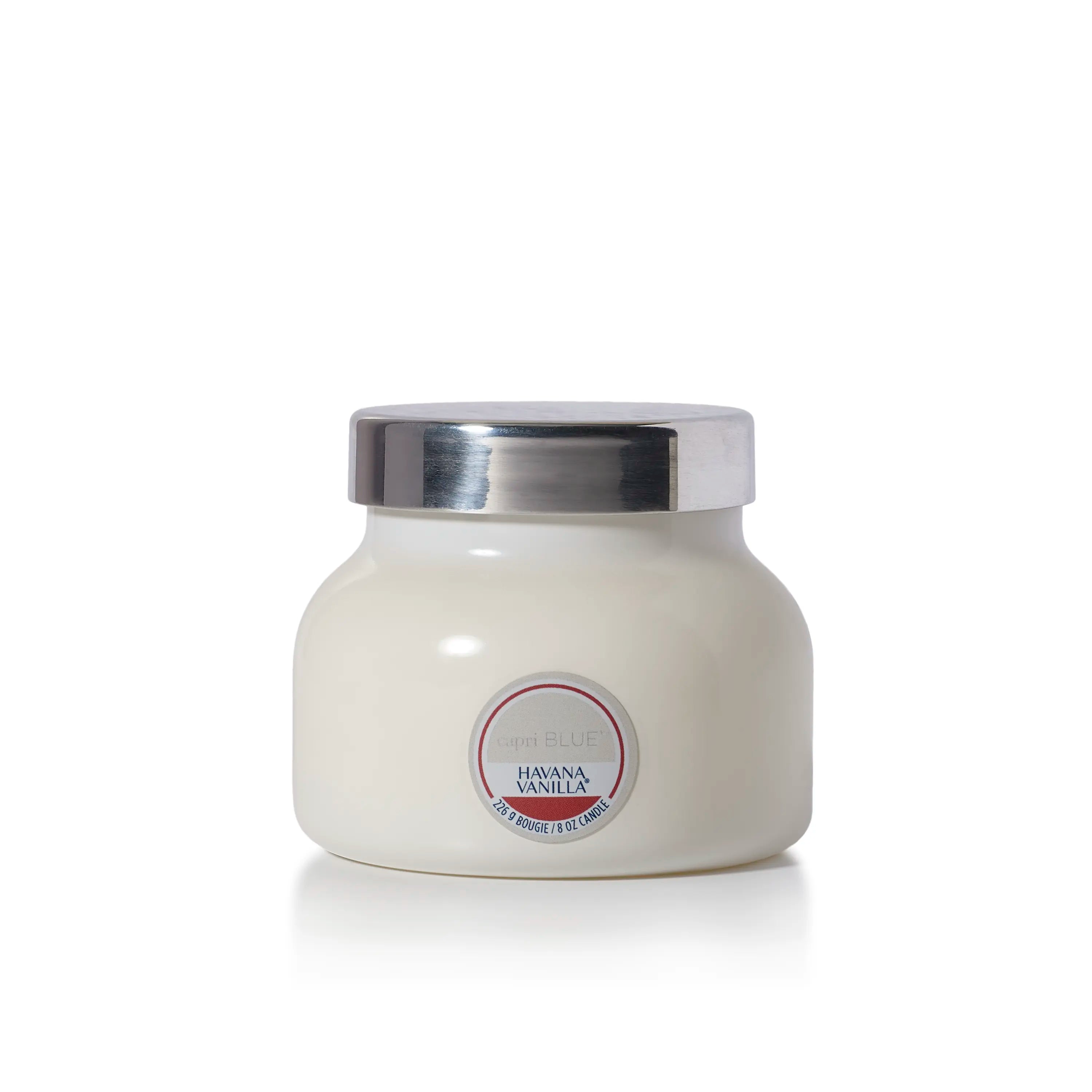A white jar candle with a metallic silver lid and a circular label reading 'capri BLUE' and 'HAVANA VANILLA'.