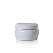 A light gray candle jar with a matching screw-on lid, shown on a clean white background with a soft reflection underneath.