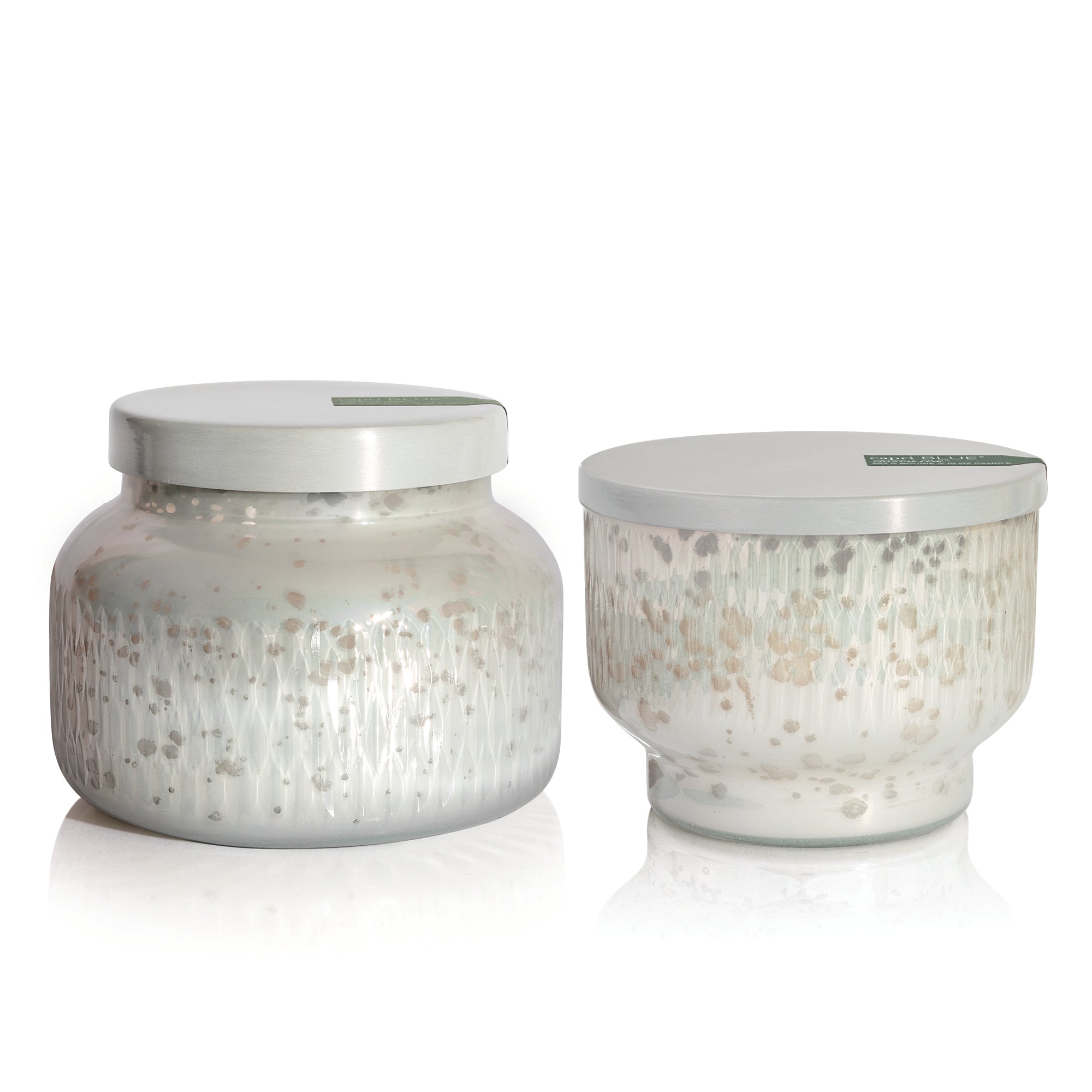 Two Crystal Pine Holiday Mercury Candles on a white background