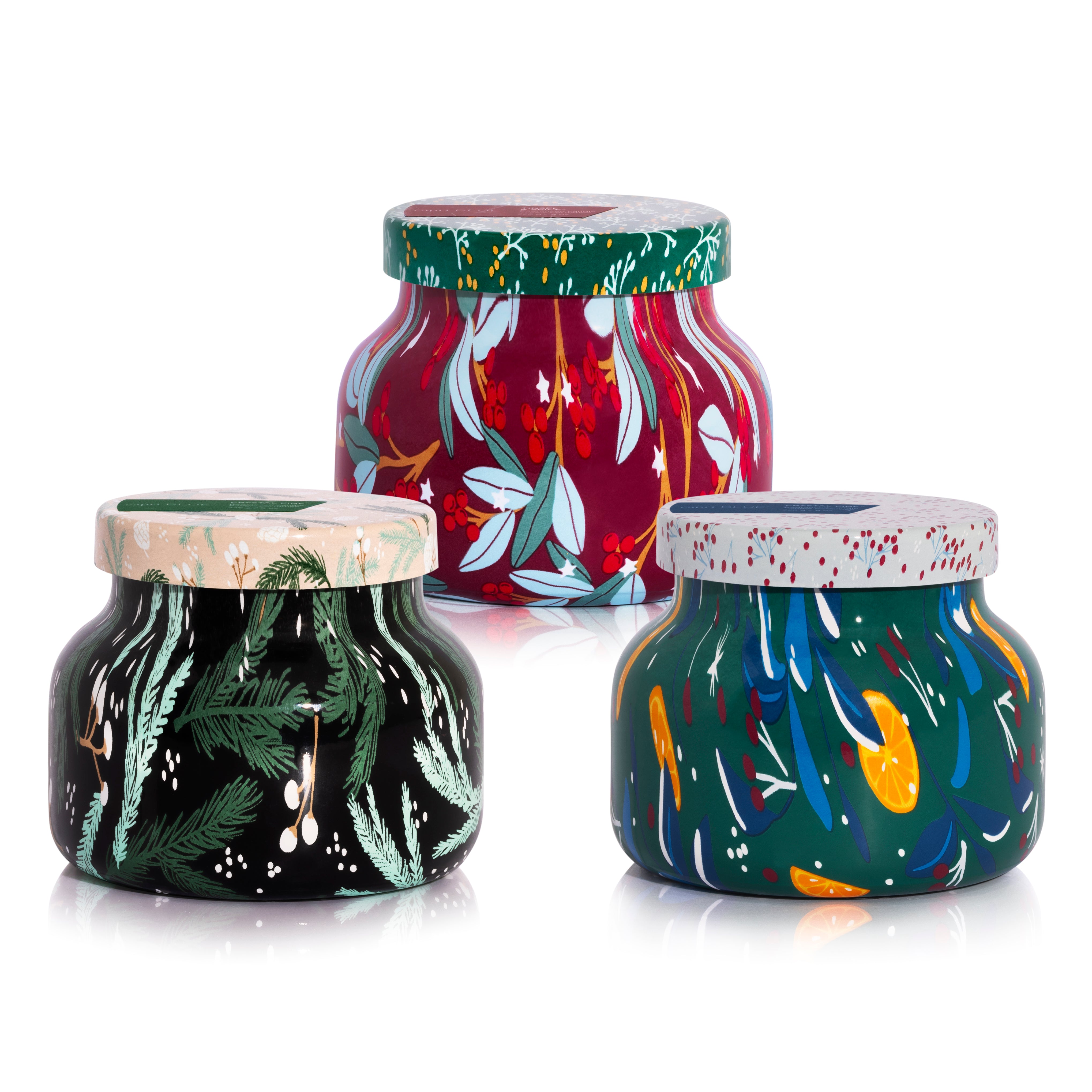 Three Holiday Pattern Play Petite Candles on a white background.