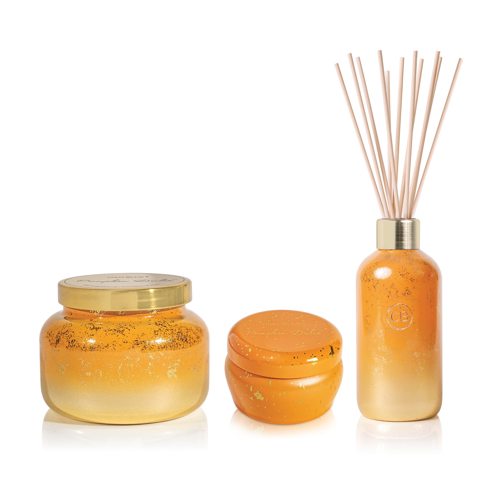 Set of orange and gold scented products including a jar, container, and diffuser on a white background