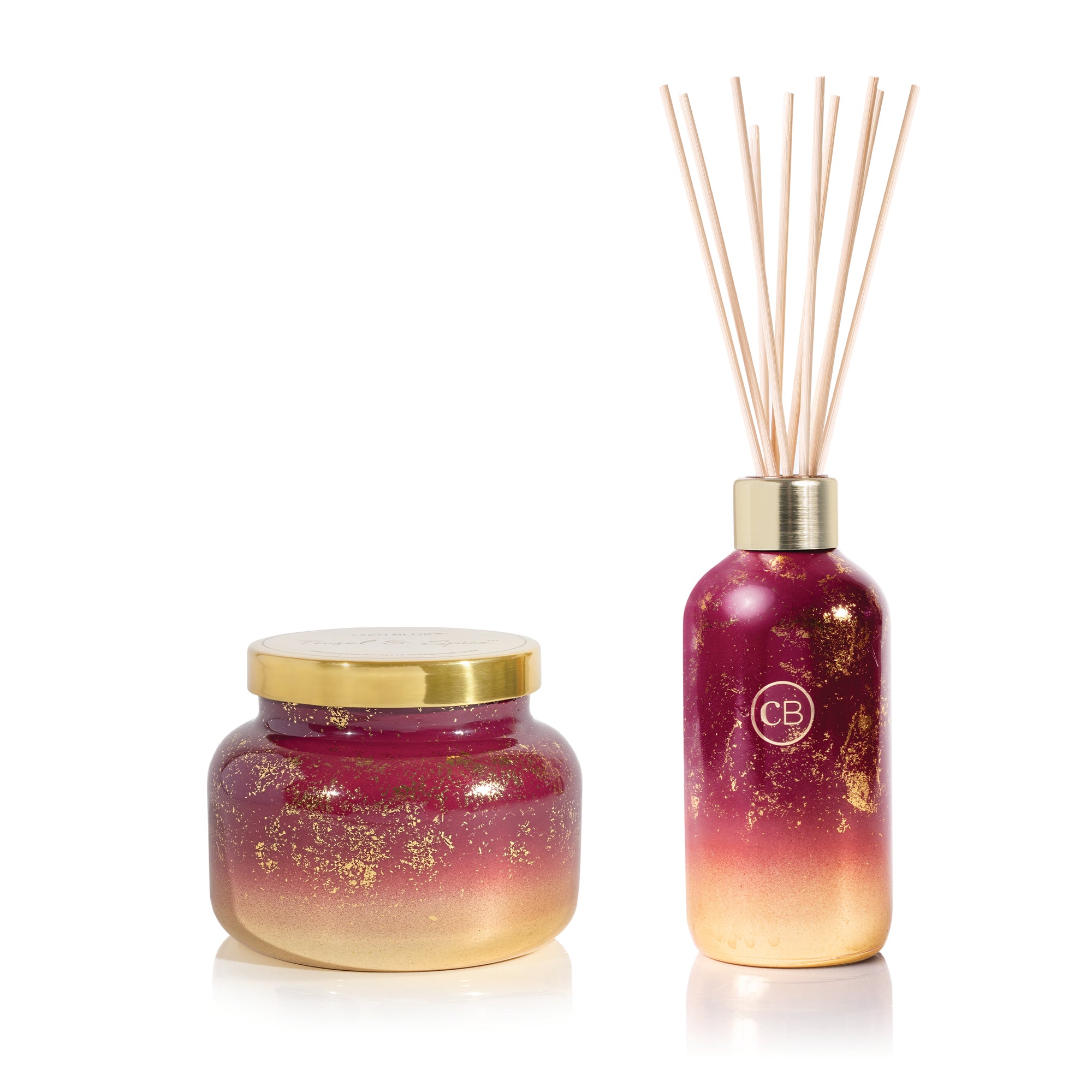 Tinsel & Spice Reed Diffuser and Signature Candle on a white background.