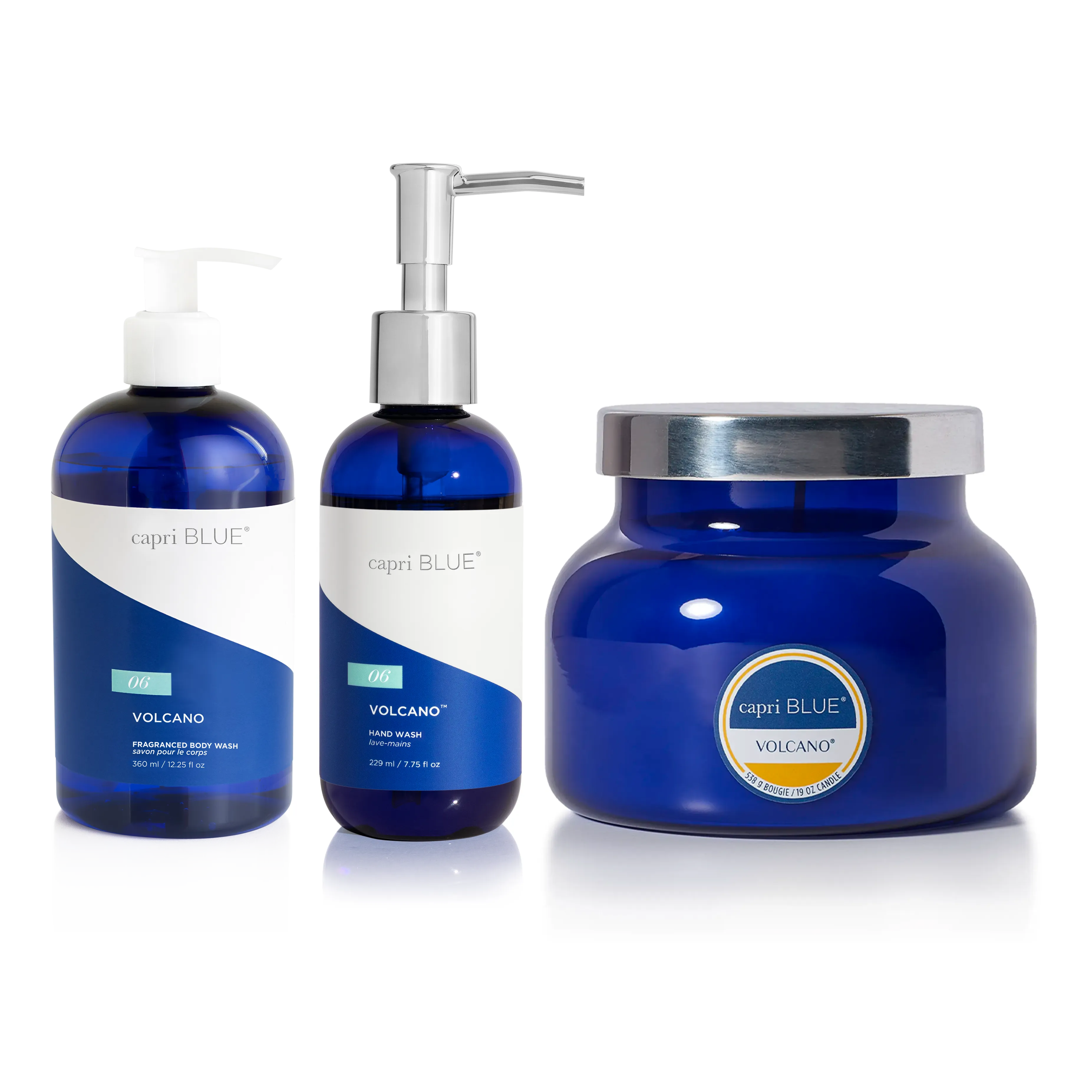 Three Capri Blue Volcano beauty and home products on a white background: a body wash bottle, a hand wash pump bottle, and a candle.