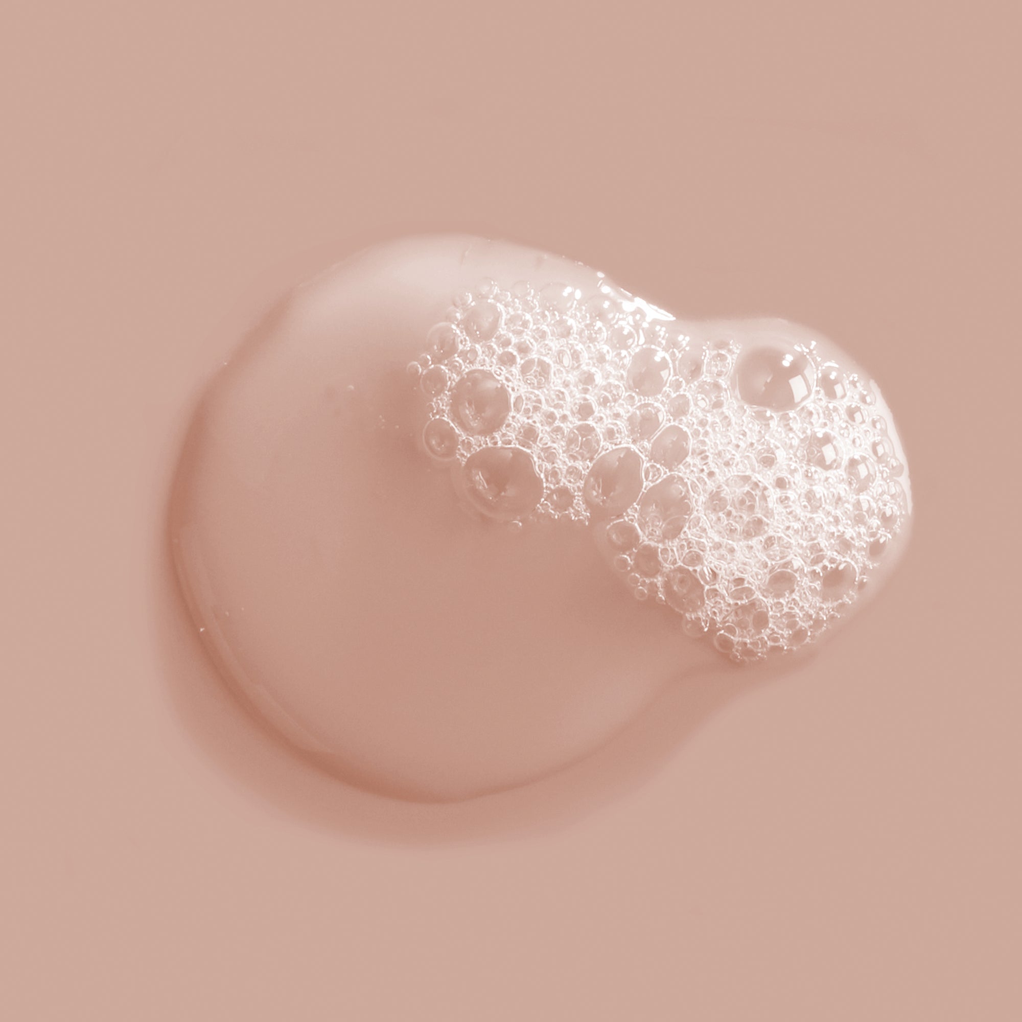 Close-up of a bubble with a textured surface on a beige background