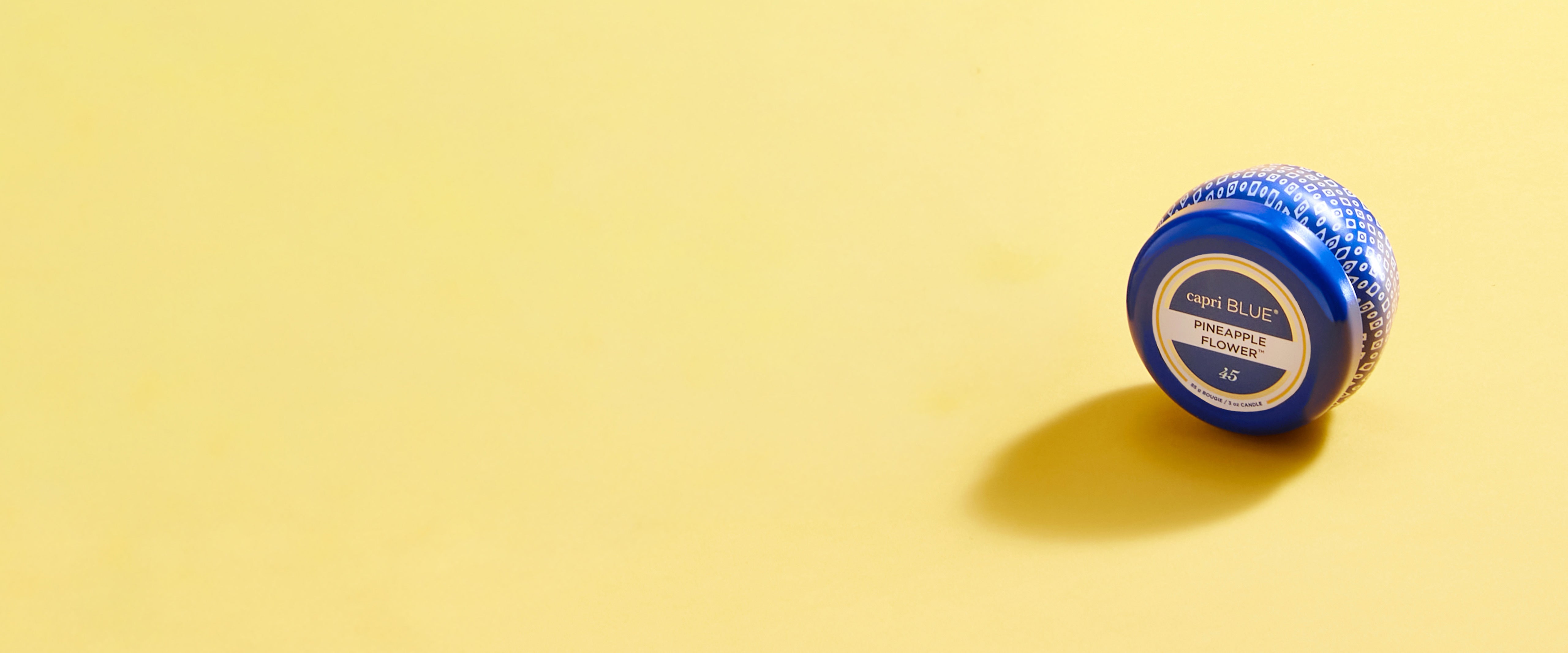 Blue container with a label on a yellow background