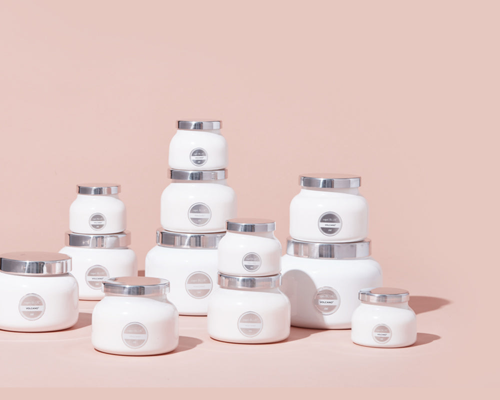 iconic white Signature volcano candles in various sizes