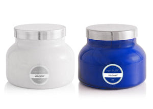 Two jars, one white and one blue, with silver lids on a white background.